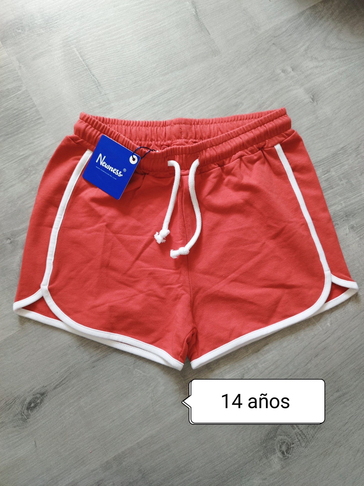 Pantalón niña deportivo rojo con ribete blanco