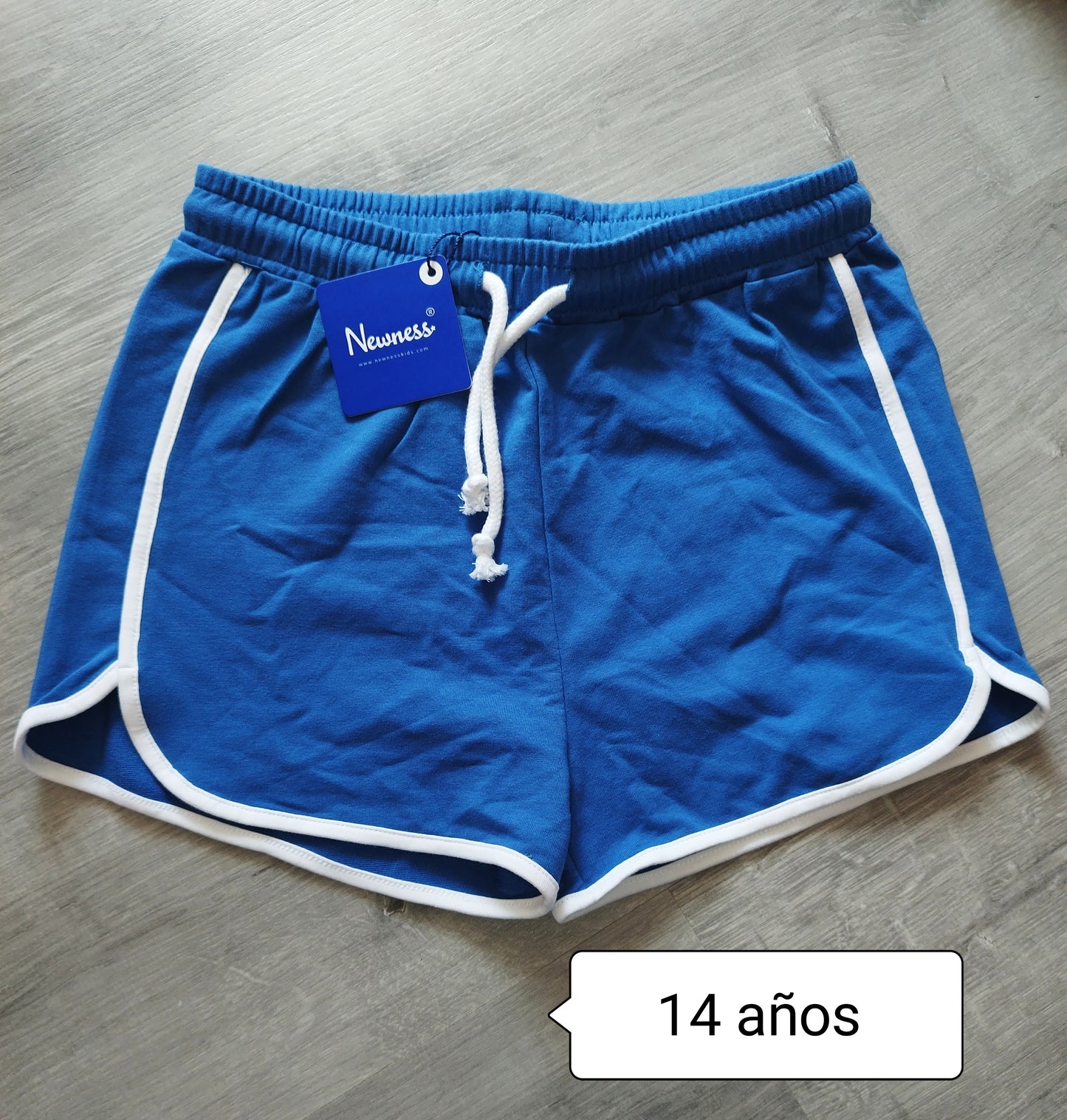 Pantalón niña deportivo azul con ribete blanco